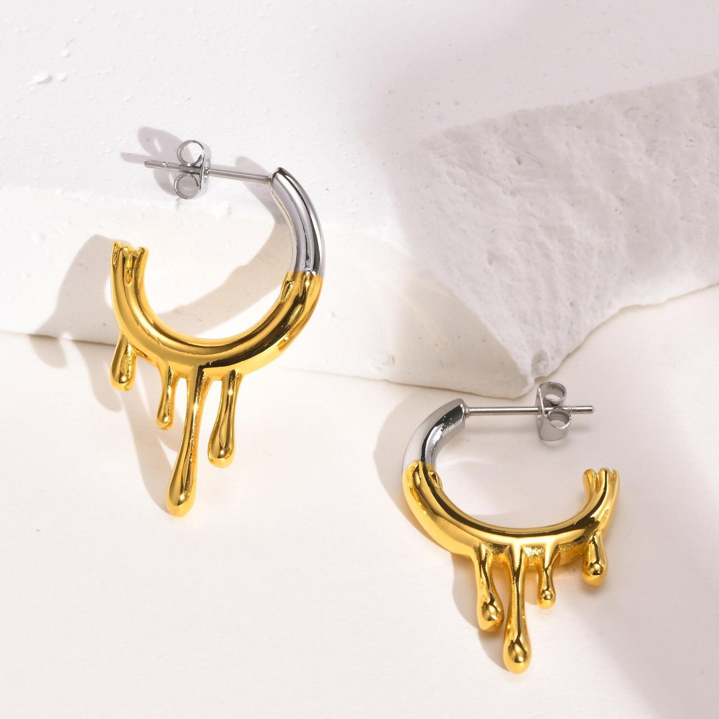 Titanium Steel Irregular Flowing Water Drop C Row Earrings