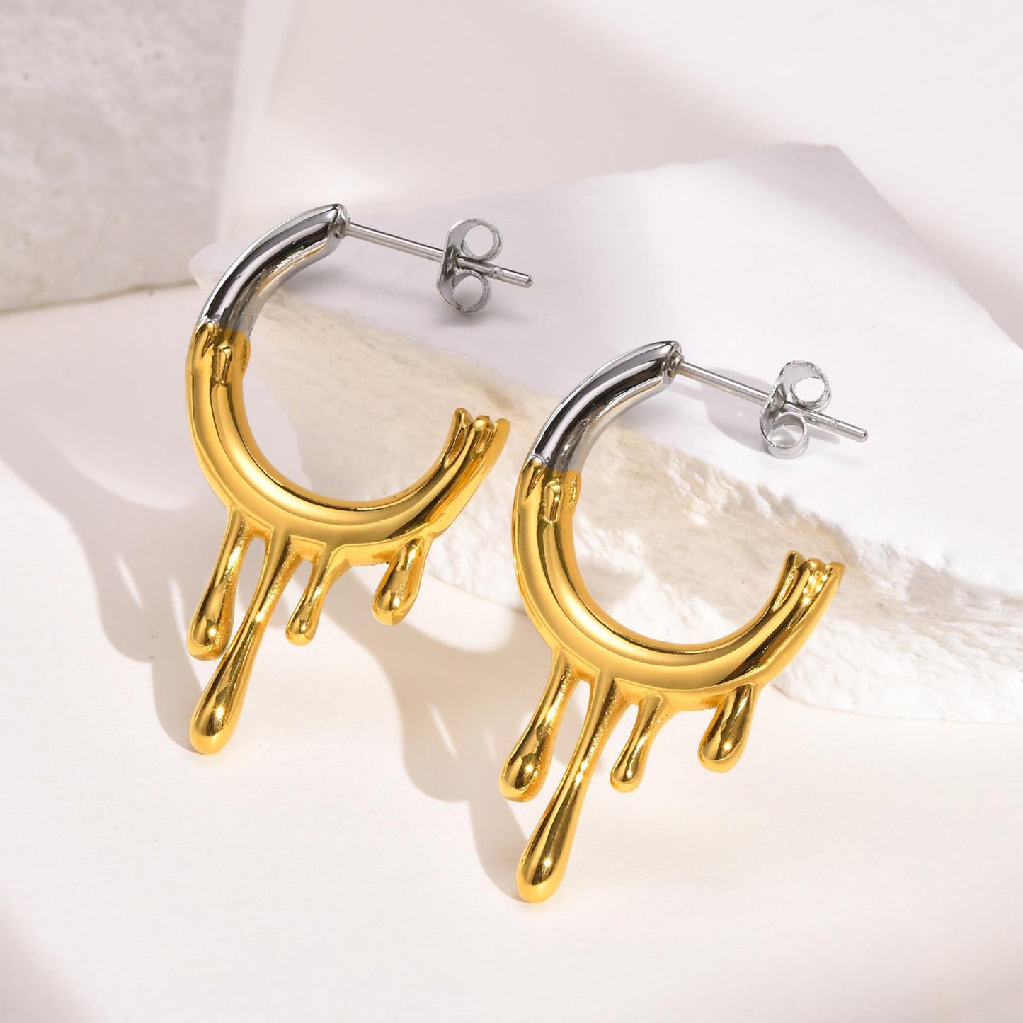 Titanium Steel Irregular Flowing Water Drop C Row Earrings